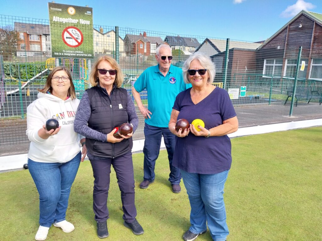 Three new bowlers with their coach Alex