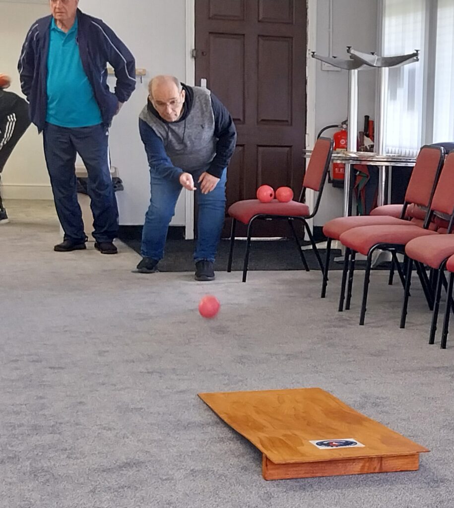 Bowler sending his bowl