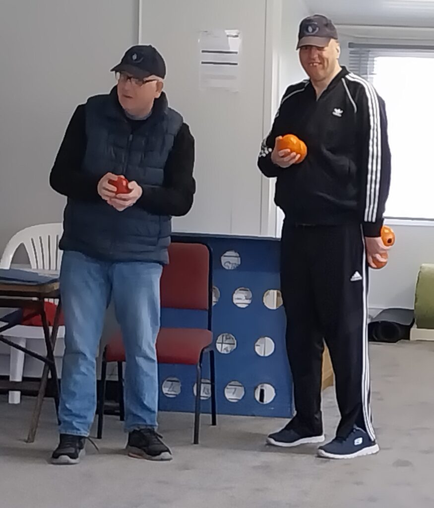 Two bowlers enjoying a game